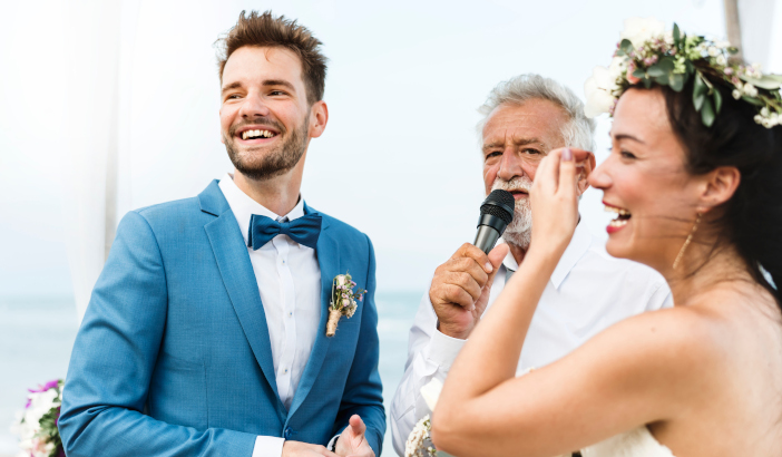 Young couple in a wedding ceremony at the beach